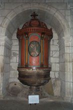 Baptismal Font in the Church.  The top is made of wood.