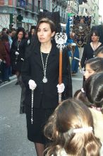 Typical Spanish señora wearing a mantilla and carrying a rosary in a  gloved hand.