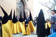 "Penitentes" gathering for the beginning of a procession.